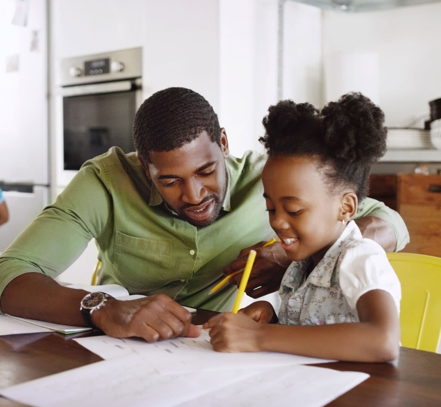 Black father helping his daughter with learning - Forever Forward empowers families